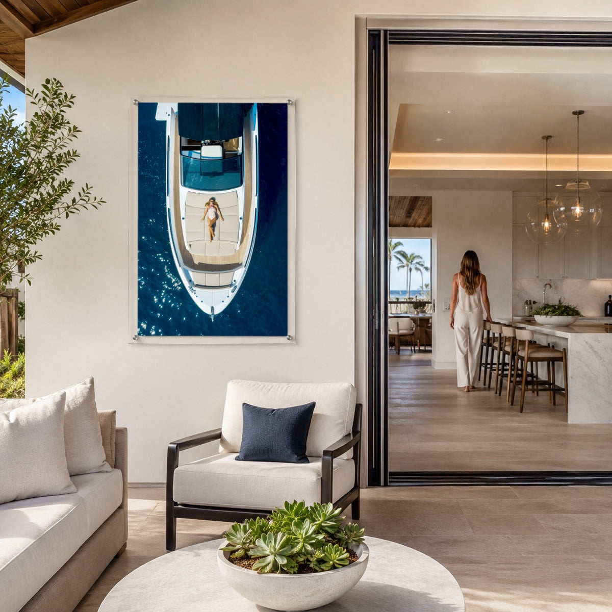 First Class Afloat acrylic wall art in a bright coastal outdoor living space with woman afar