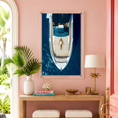 First Class Afloat acrylic wall art displayed in a pink entryway console