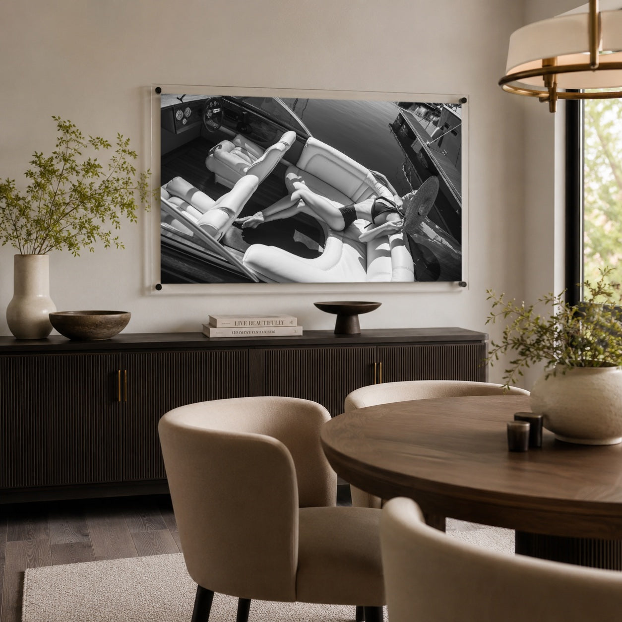 Sea La Vie BW wall art hung inside a modern dining room over a sideboard