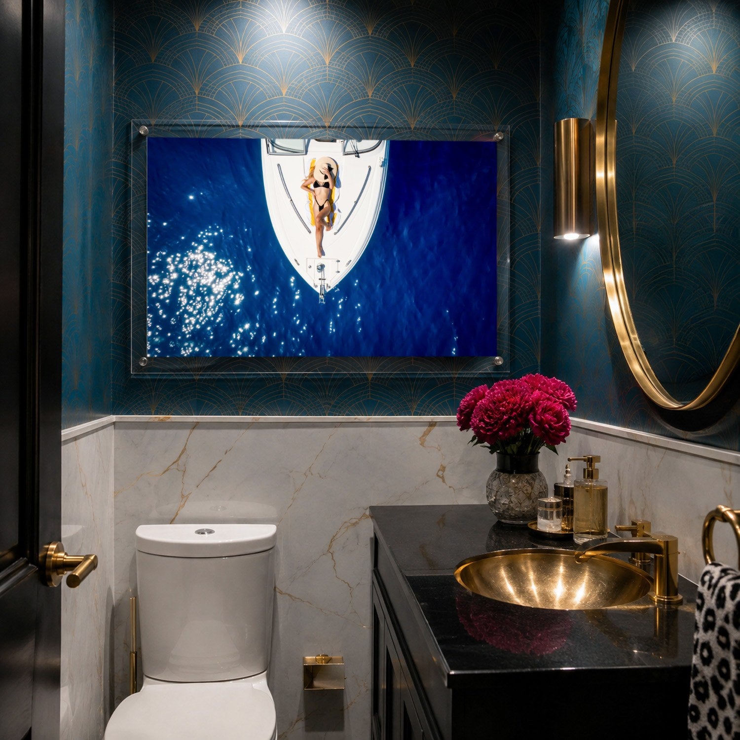 Sun Deck Society wall art displayed inside a moody art deco powder room