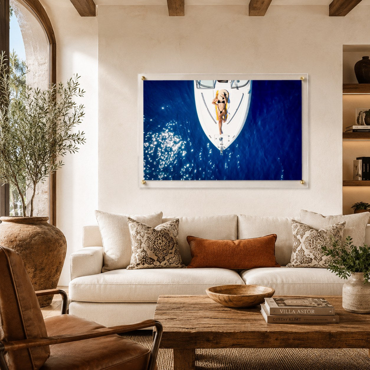Sun Deck Society wall art styling a Tuscan living room by an arch window