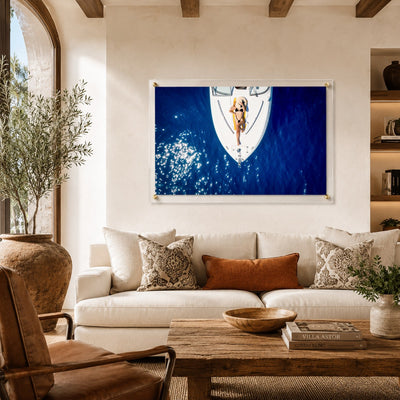Sun Deck Society wall art styling a Tuscan living room by an arch window