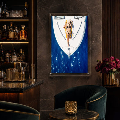 Sun Deck Society wall art decorating a dark moody home bar seating area