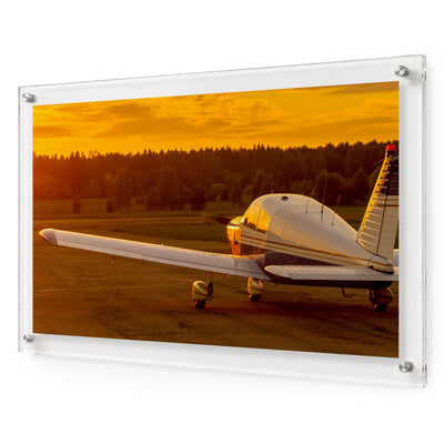 Piper, Cleared for Sunset acrylic wall art featuring a small airplane at golden hour