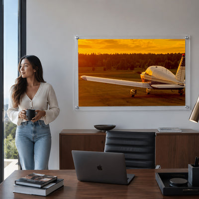 Golden hour airplane acrylic wall art with dramatic orange sky