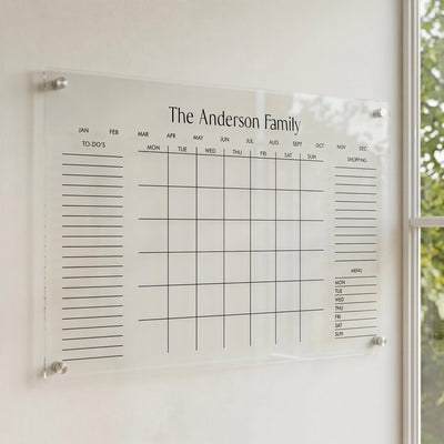 acrylic wall calendar inside next to window