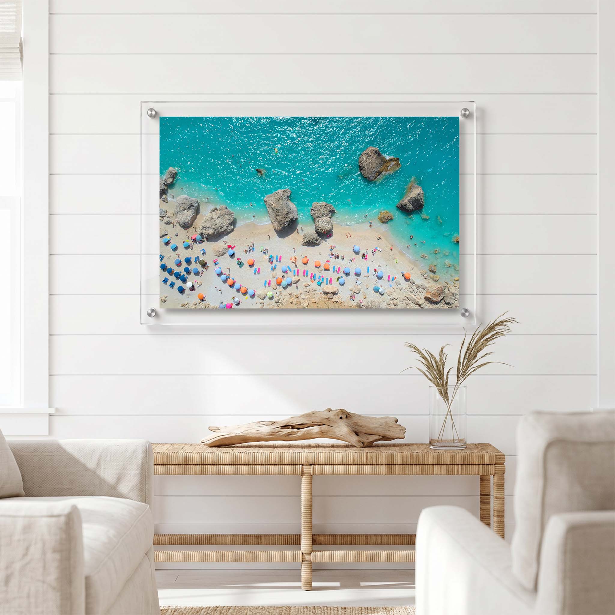Aerial beach acrylic wall art displayed  in a bright coastal living room