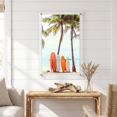 Vertical acrylic print featuring surfboards lined up displayed in a bright room