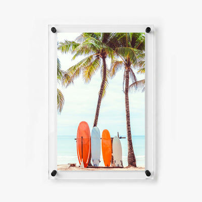 Coastal wall art with colorful surfboards, palm trees, and a peaceful beach horizon