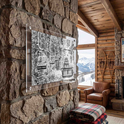 Acrylic wall art of an empty ski chairlift displayed in a cabin