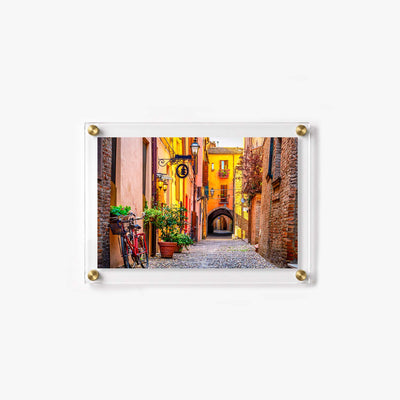 Vibrant old town street with cobblestones, flower boxes, and colorful building facades