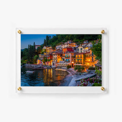 Lake Como acrylic wall art showing hillside homes, boats, and waterfront restaurants after dark