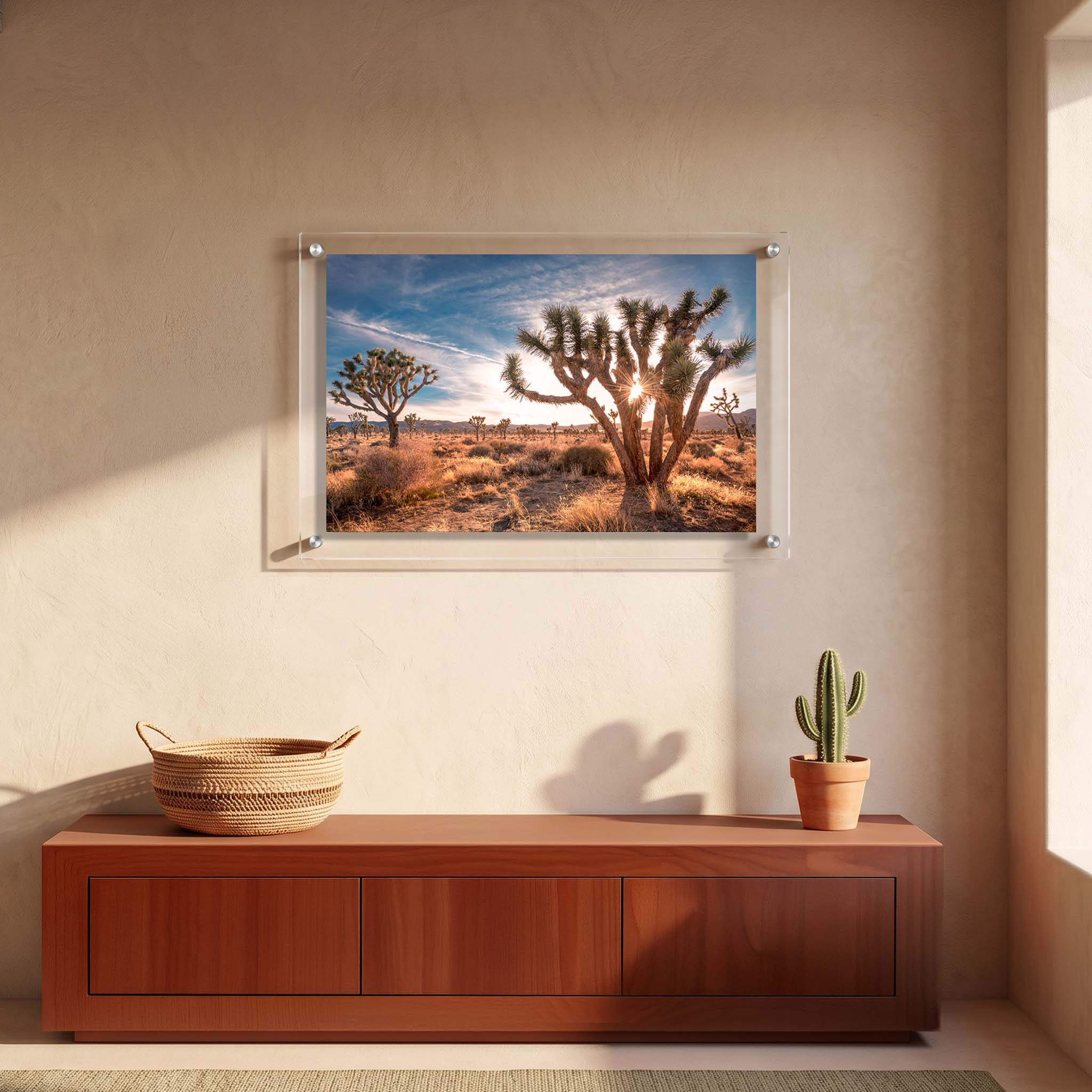 Desert landscape acrylic print with Joshua trees displayed in a modern entryway