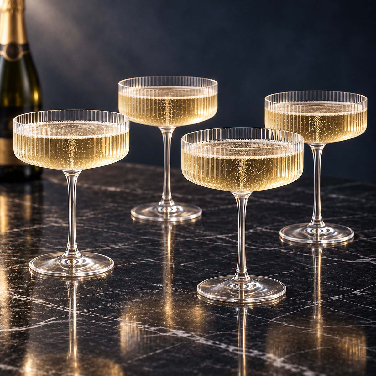 fitzroy ribbed champagne coupe glasses set of 4 with bubbly