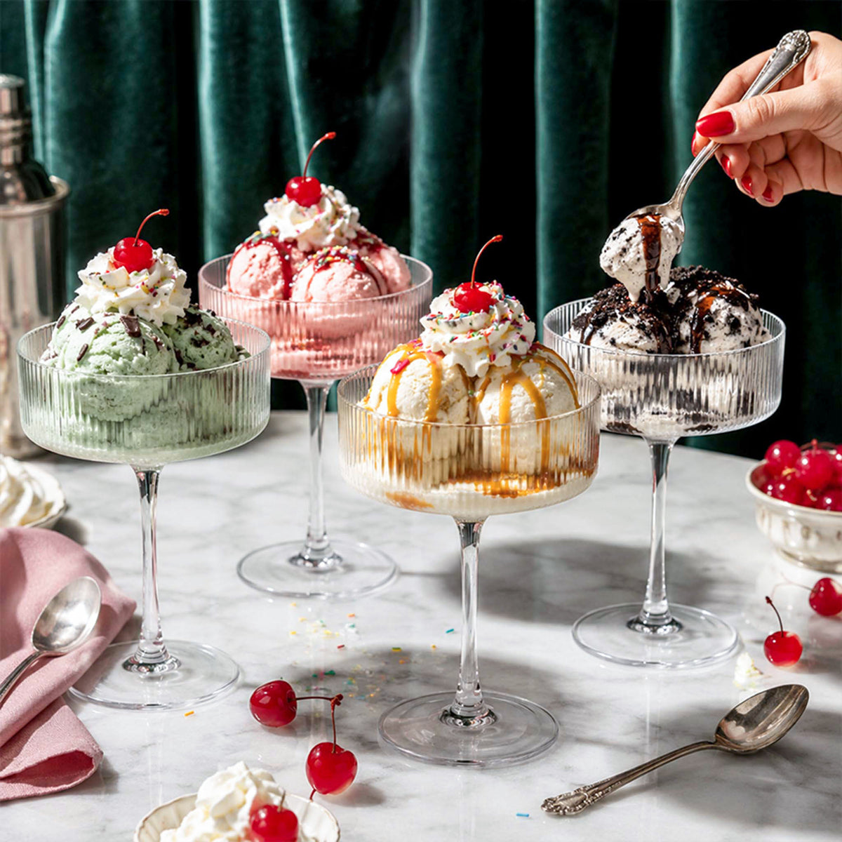 coupe dessert glasses filled with ice cream sundaes