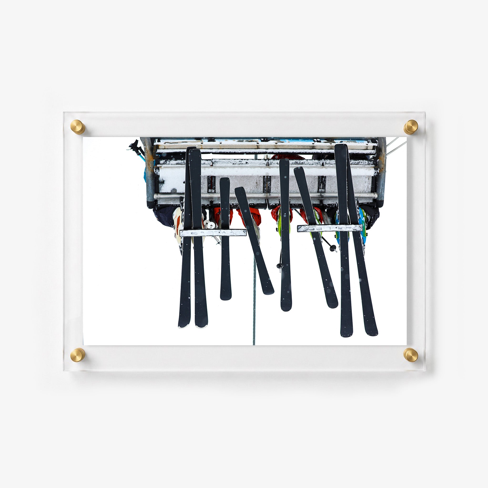 Winter acrylic wall art featuring a ski lift carrying riders and equipment 