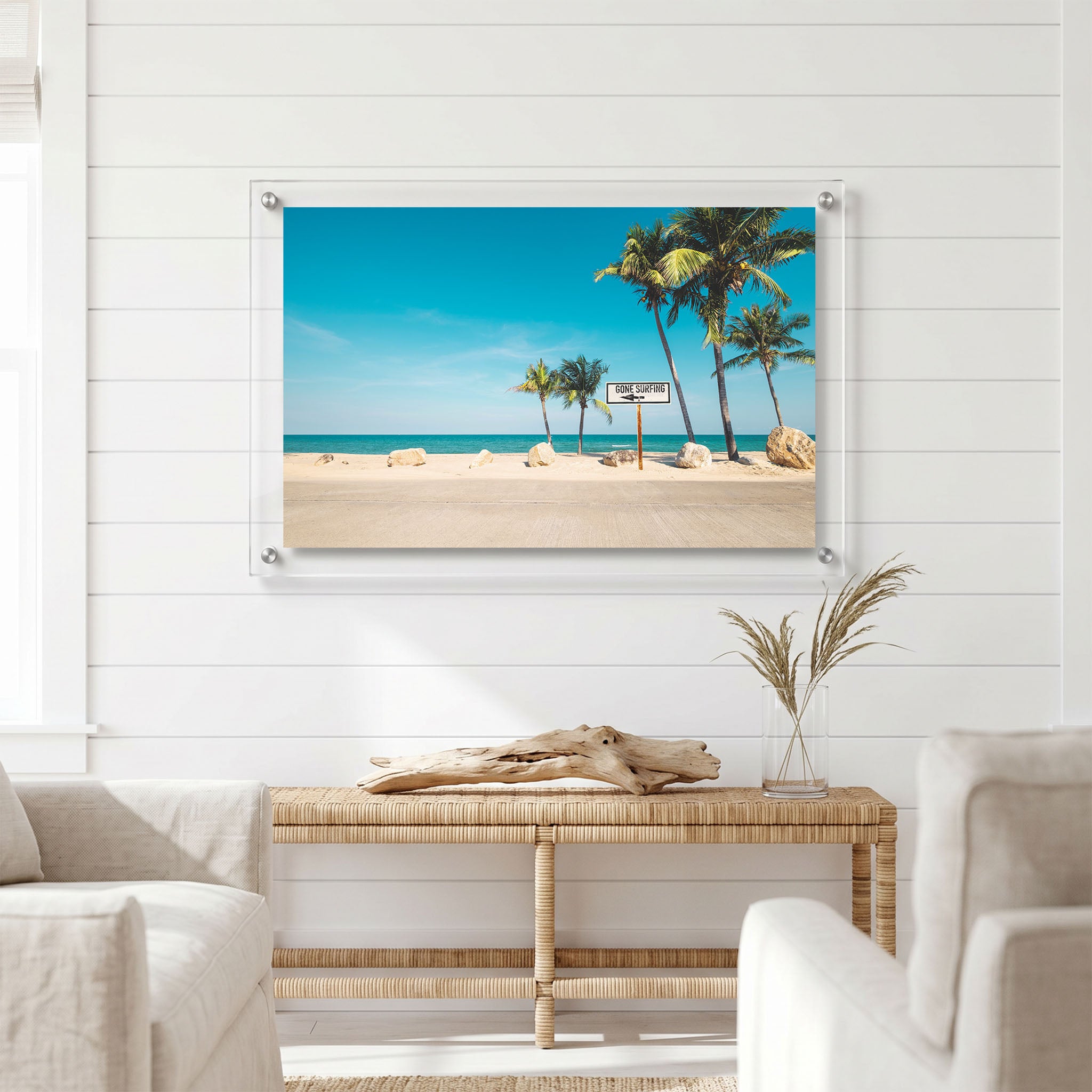 Coastal wall art displayed in a bright light room