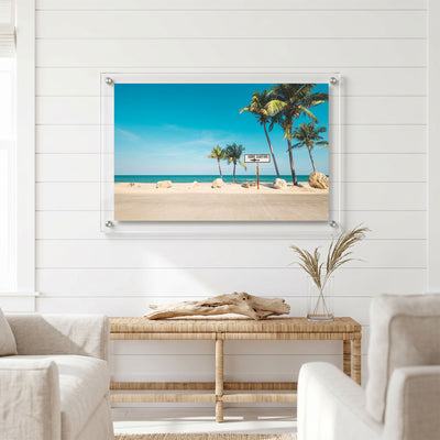 Coastal wall art displayed in a bright light room