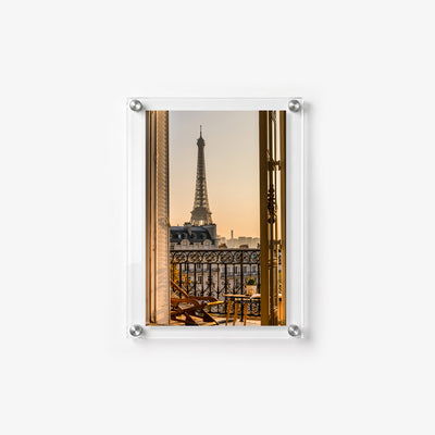 Romantic Paris wall art featuring the Eiffel Tower beyond a sunlit balcony