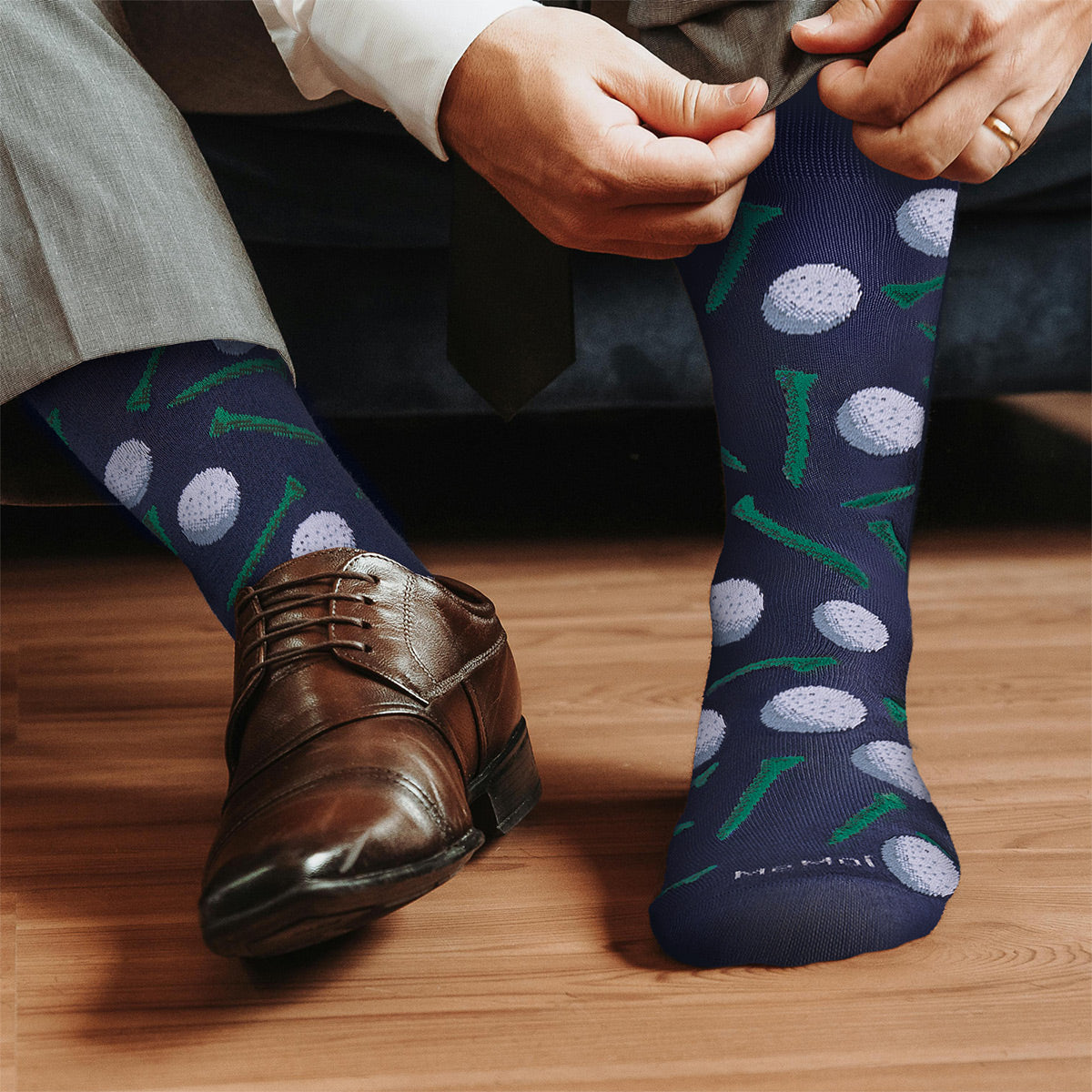golf graphic socks being worn by man and shown