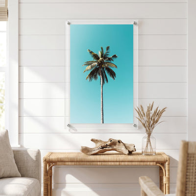 Minimalist tropical wall art showing a lone palm tree displayed in a bright room