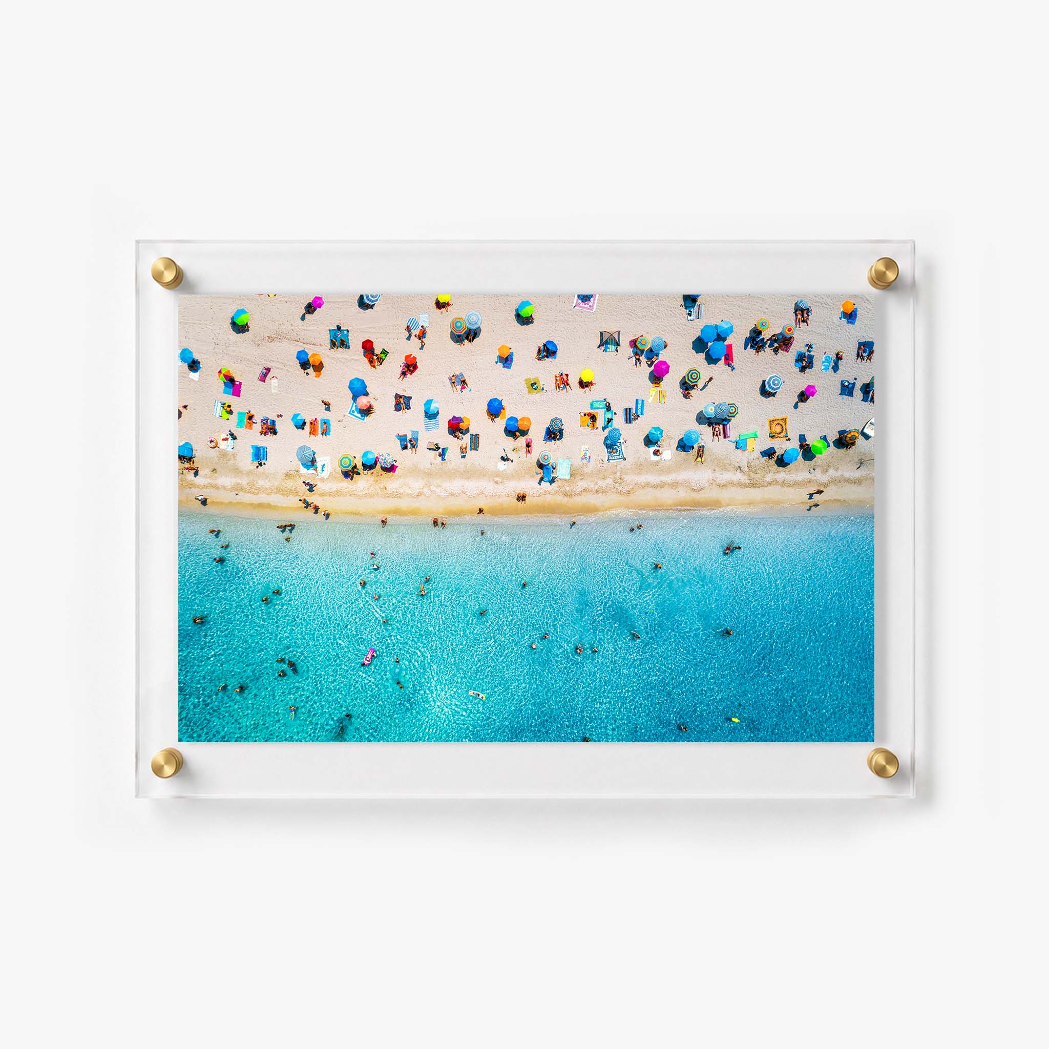 Aerial coastal wall art showing a sunny beach filled with visitors 