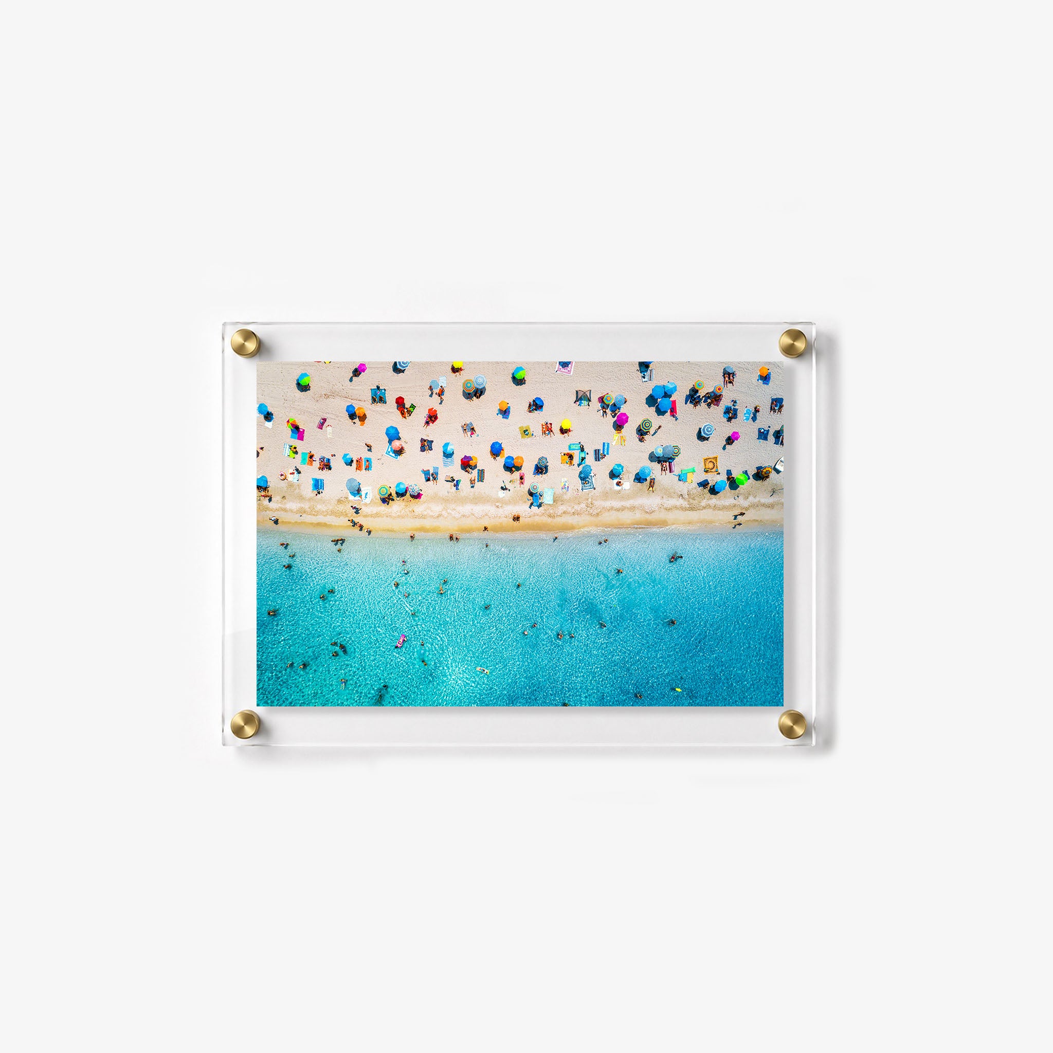 Summer wall art featuring swimmers in blue water beside a busy sandy beach