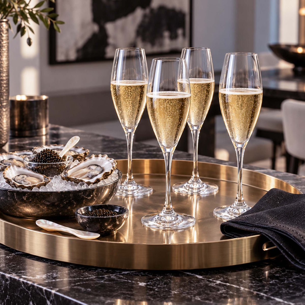 elegant champagne flutes displayed with oysters and caviar