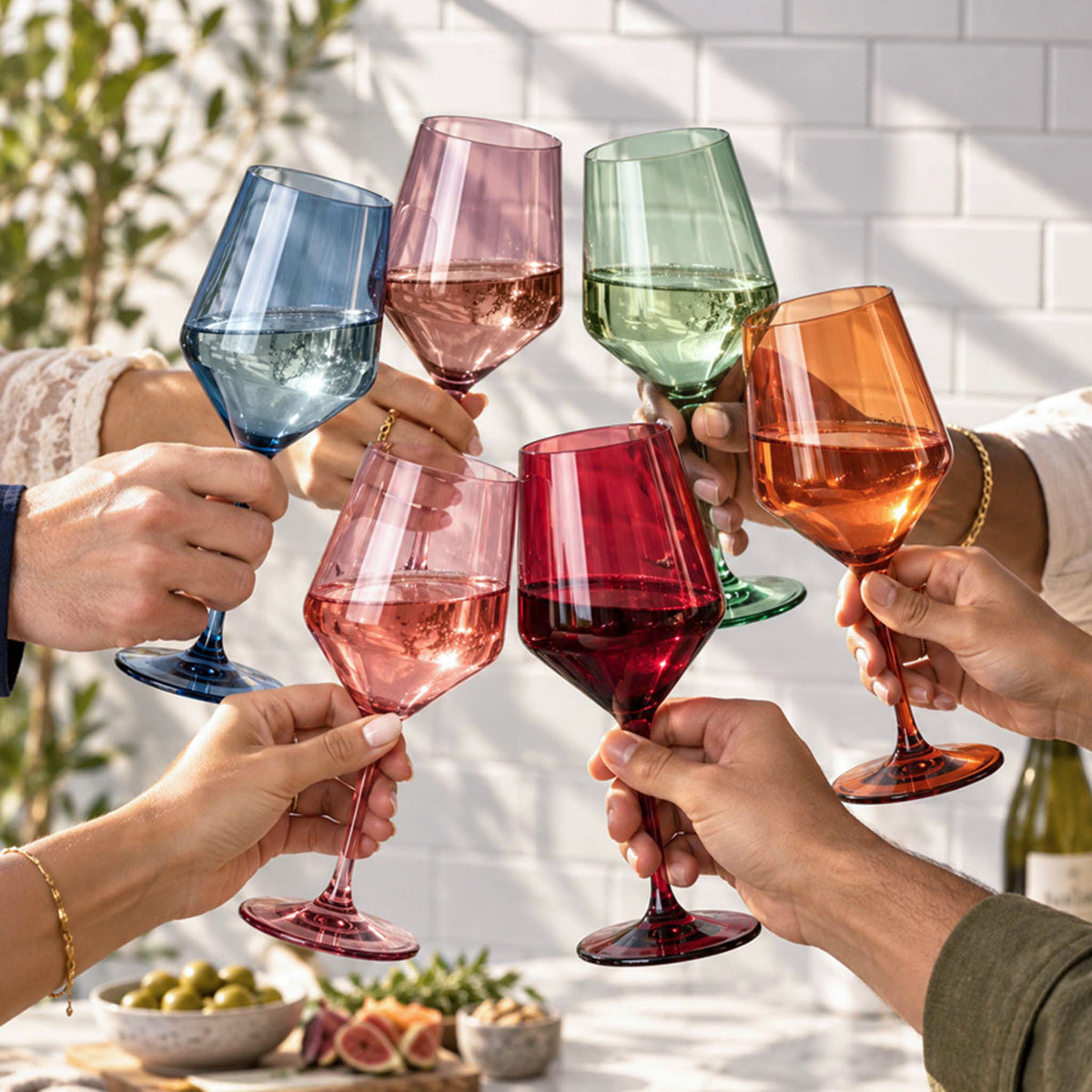 friends toasting with colorful Bellora wine glasses
