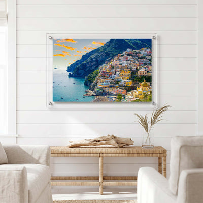 Amalfi Coast wall art showing colorful buildings displayed in a bright living room