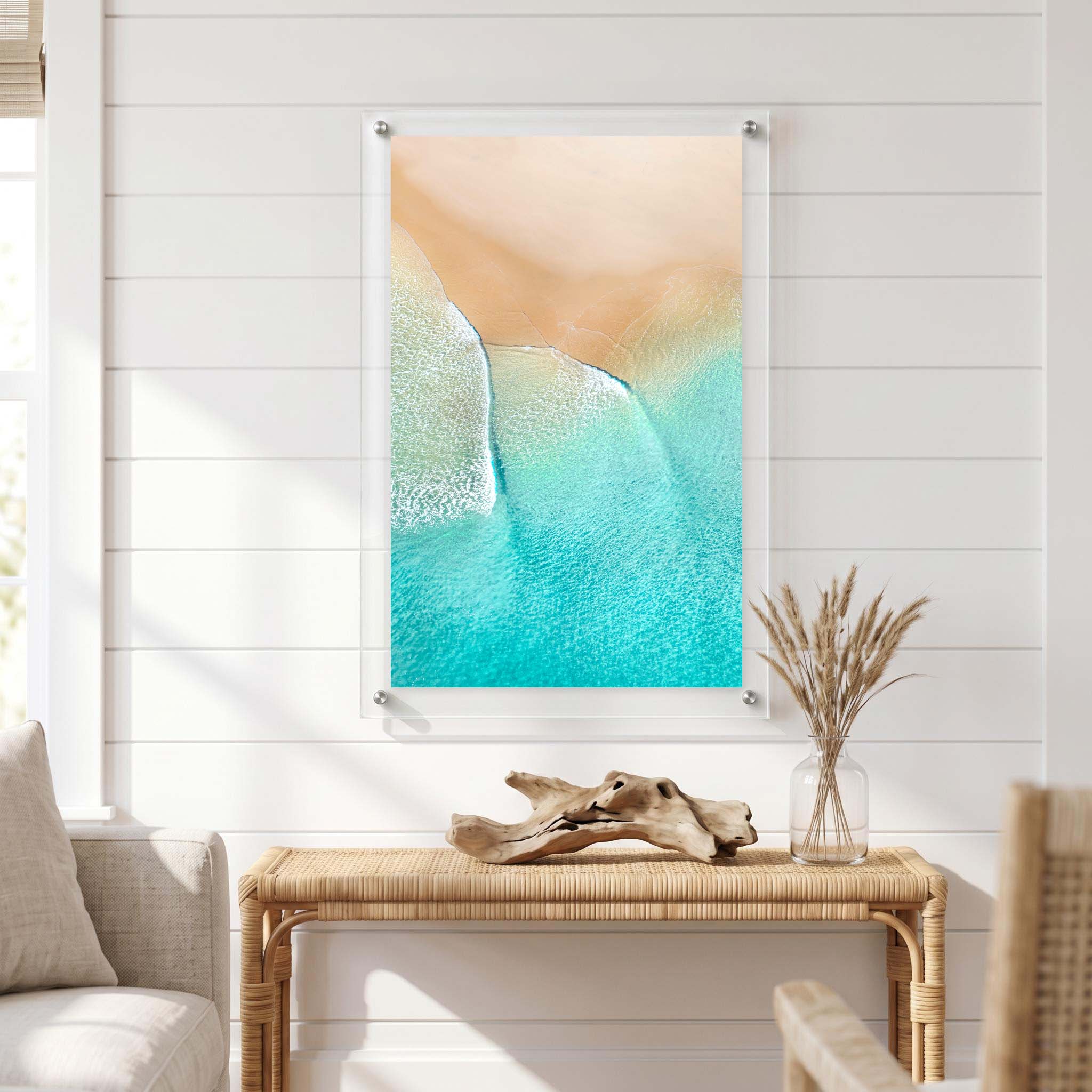 Aerial coastal scene with aqua ocean water displayed in a bright room