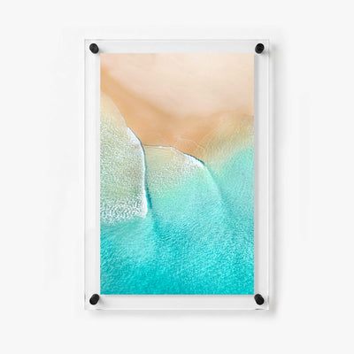Vertical beach wall art showing white waves washing across turquoise water