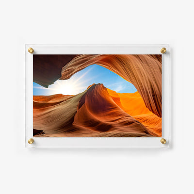 Scenic desert wall art featuring sculpted sandstone curves and a sunlit opening