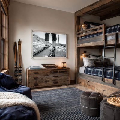 Black and white mountain road wall art in a rustic mountain bunk room