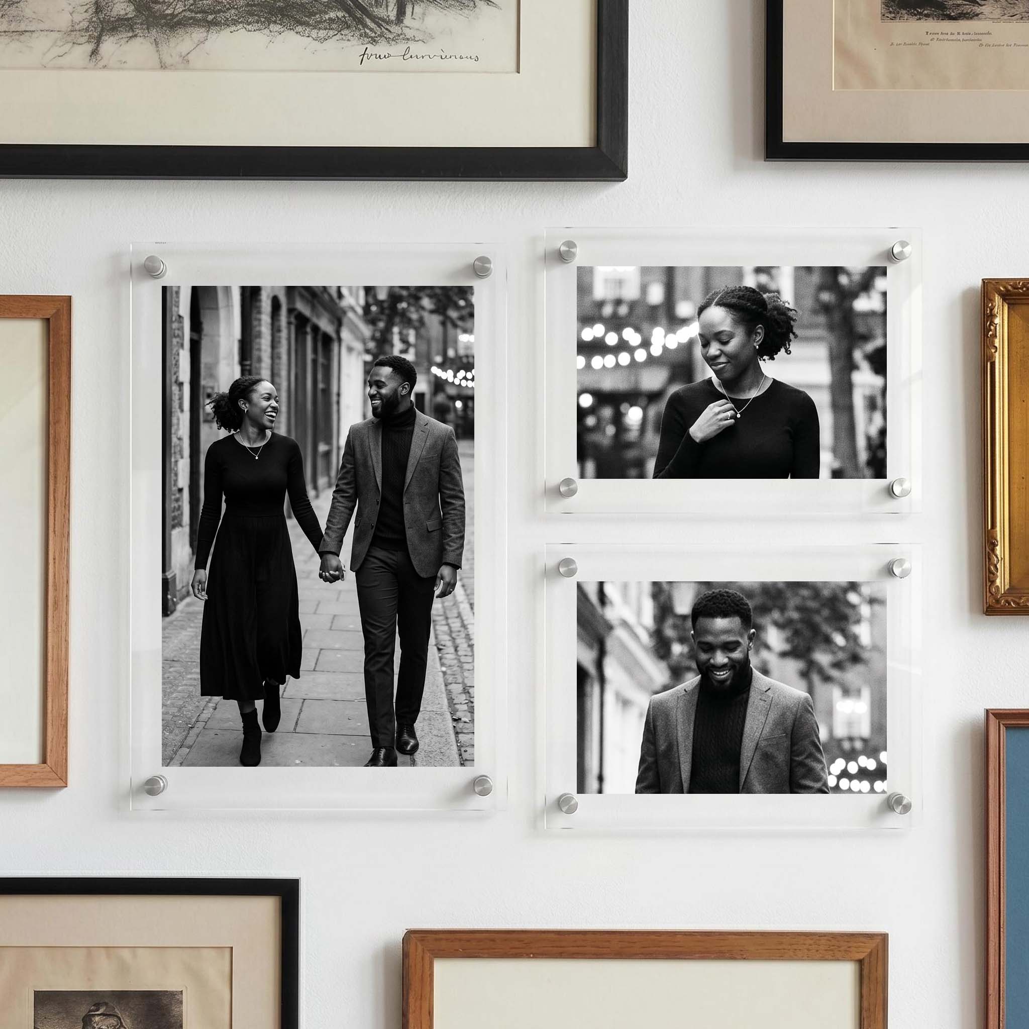 Acrylic photo print display featuring three black and white couple portraits