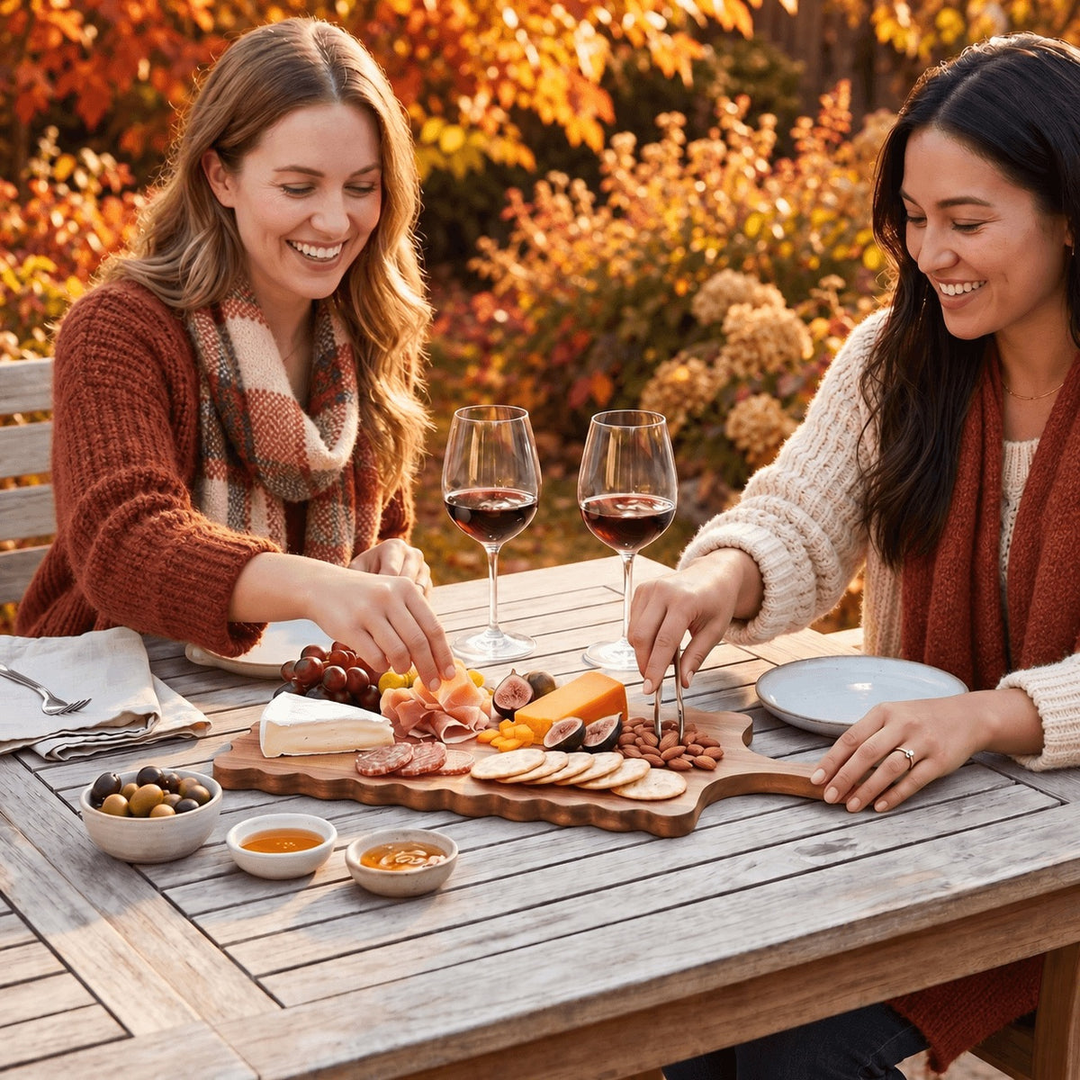 fall entertaining with people gathering around table with food