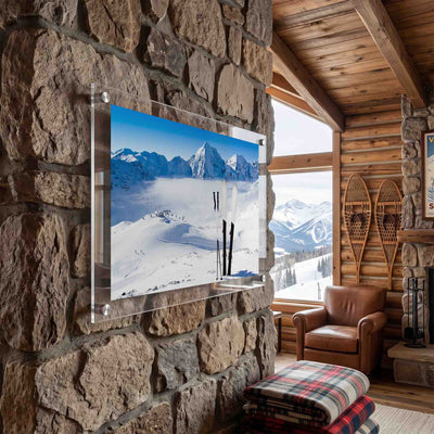 Pair of skis wall art planted on a snowy ridge displayed in a mountain cabin