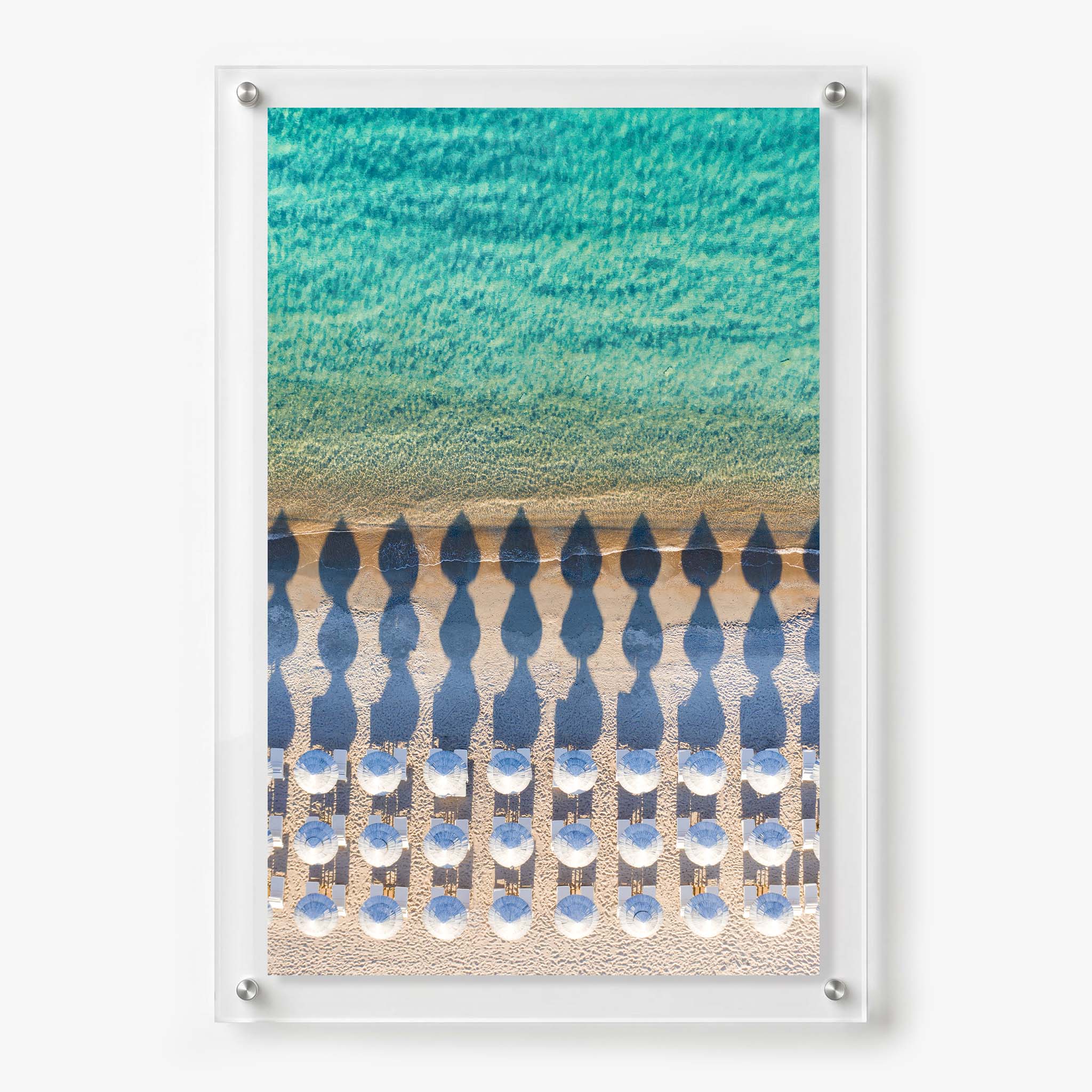 Acrylic wall art featuring an aerial view of white beach umbrellas