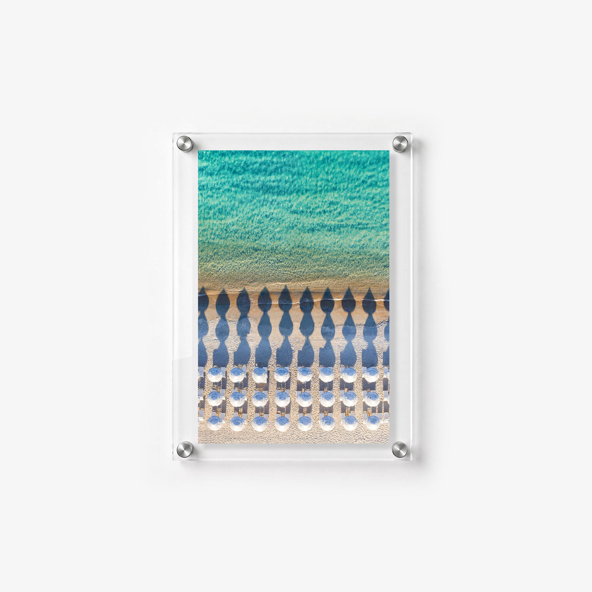 Vertical beach wall art featuring symmetrical umbrellas
