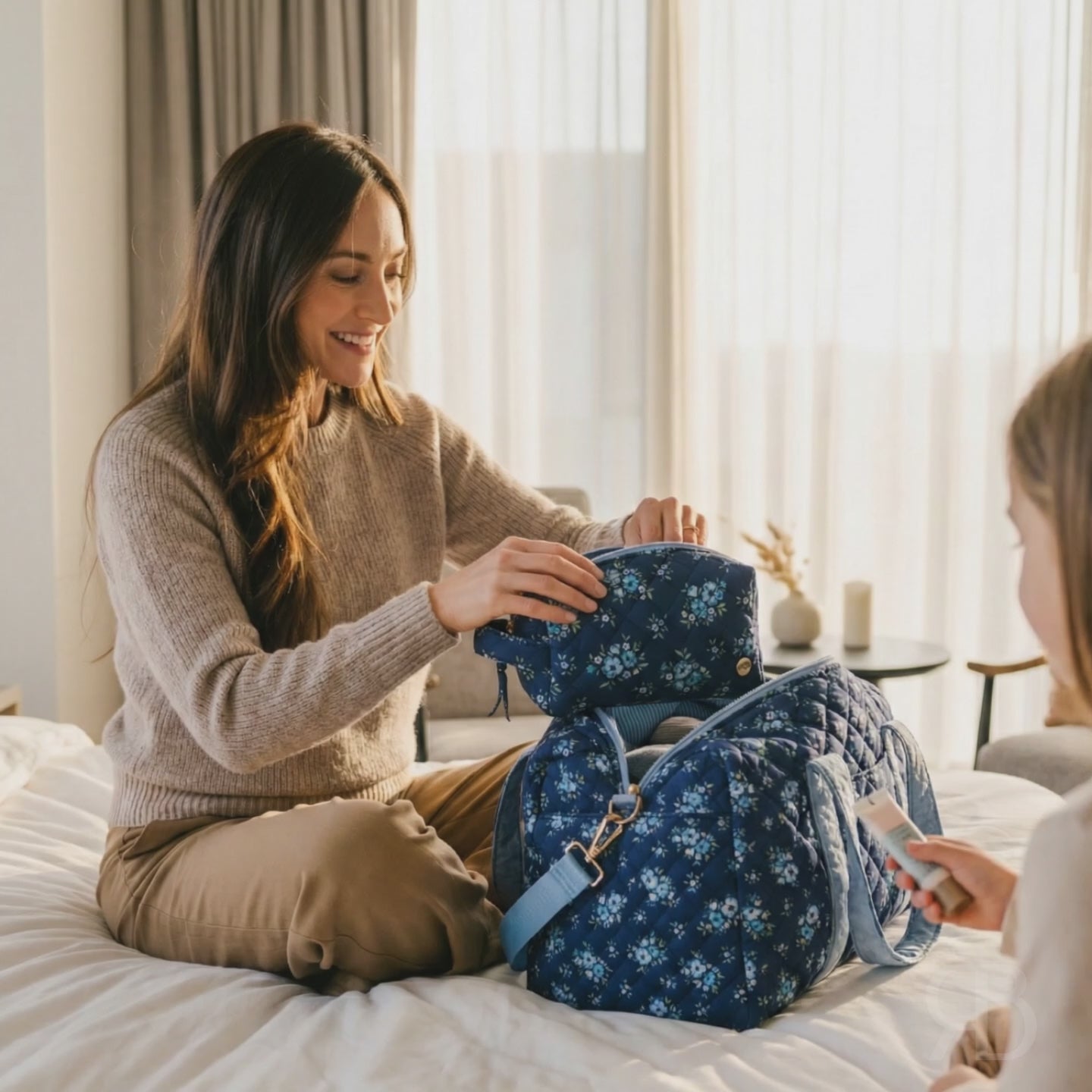 Quilted Duffle Carryall Weekender Bag in Daydream Navy with matching pouch used by a woman