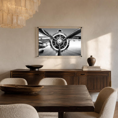 Prop Culture wall art hanging above a rustic dark wood dining room
