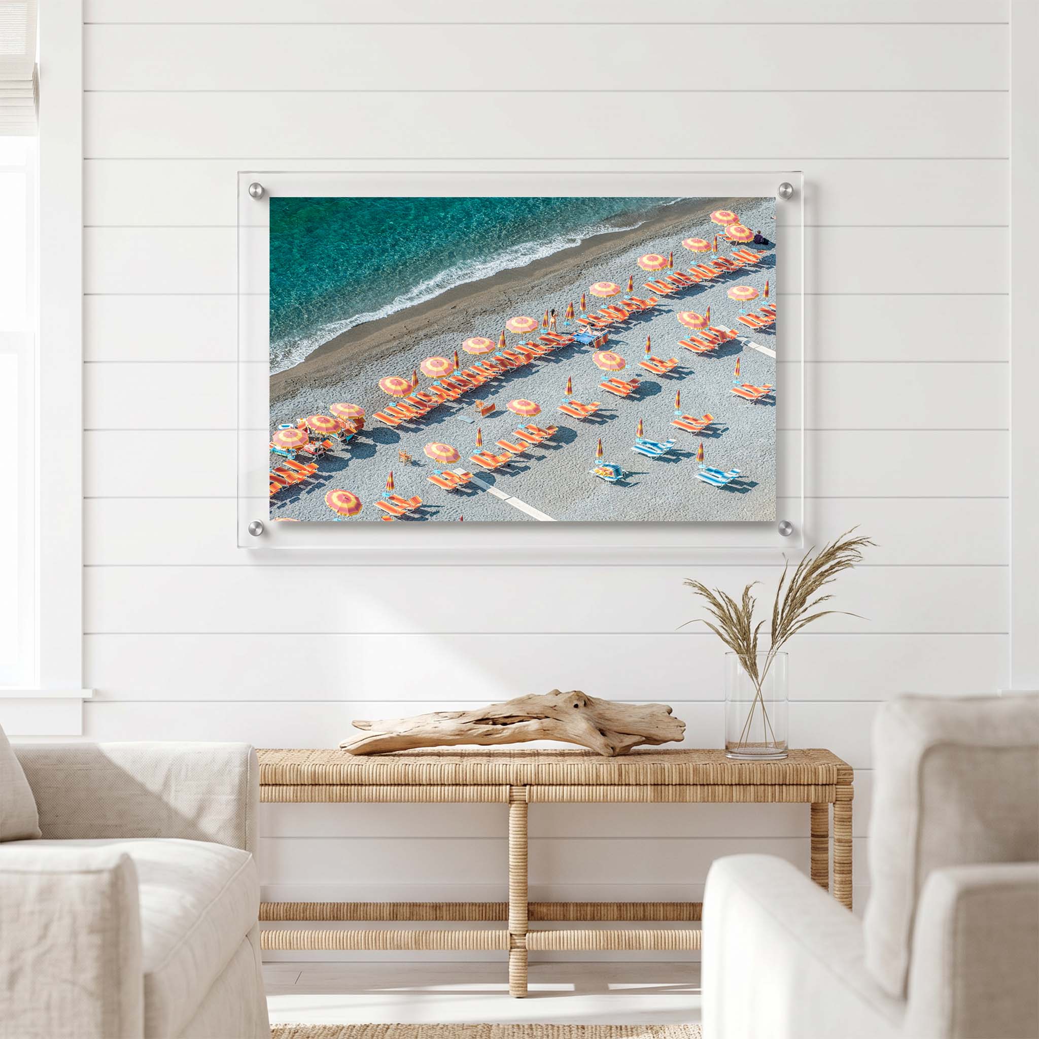 Acrylic wall art featuring rows of colorful umbrellas displayed in a bright room