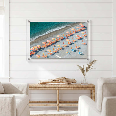 Acrylic wall art featuring rows of colorful umbrellas displayed in a bright room