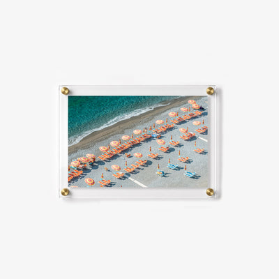 Colorful seaside wall print featuring an organized beach club along the ocean