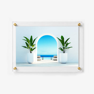Horizontal acrylic print featuring an arched doorway opening toward an infinity pool and the ocean