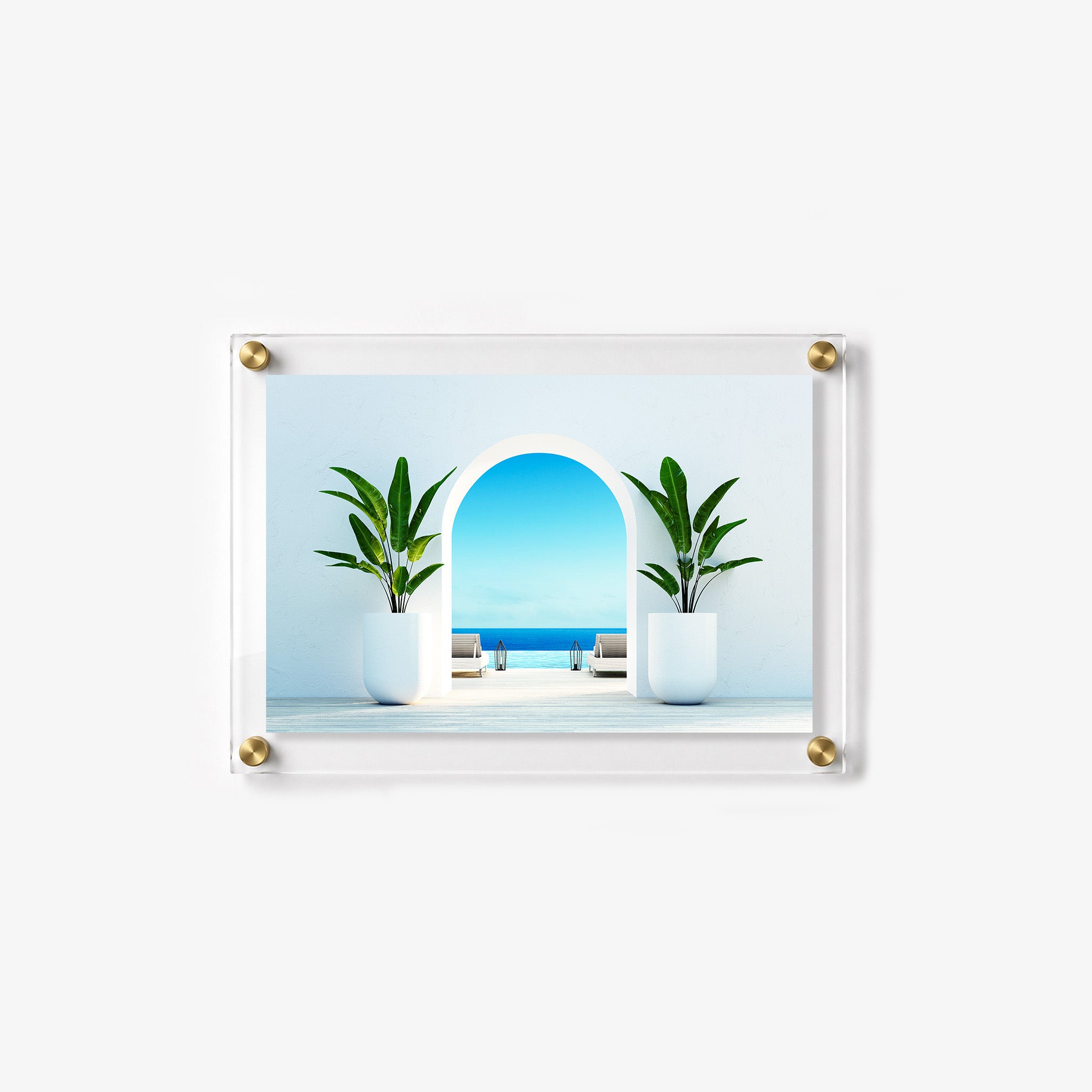 Luxury seaside retreat with symmetrical potted plants, white lounge chairs, and clear blue water