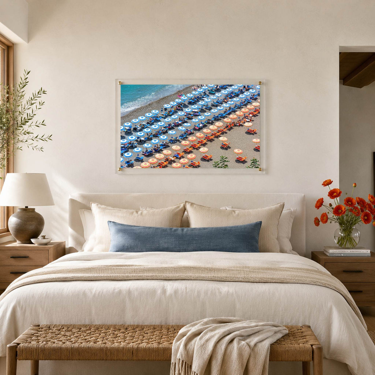 Stripes and Spritz wall art above a bed in a serene bedroom with lamp and flowers