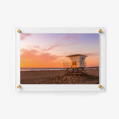 Sunset coastal wall art print featuring a lifeguard station and sandy shoreline