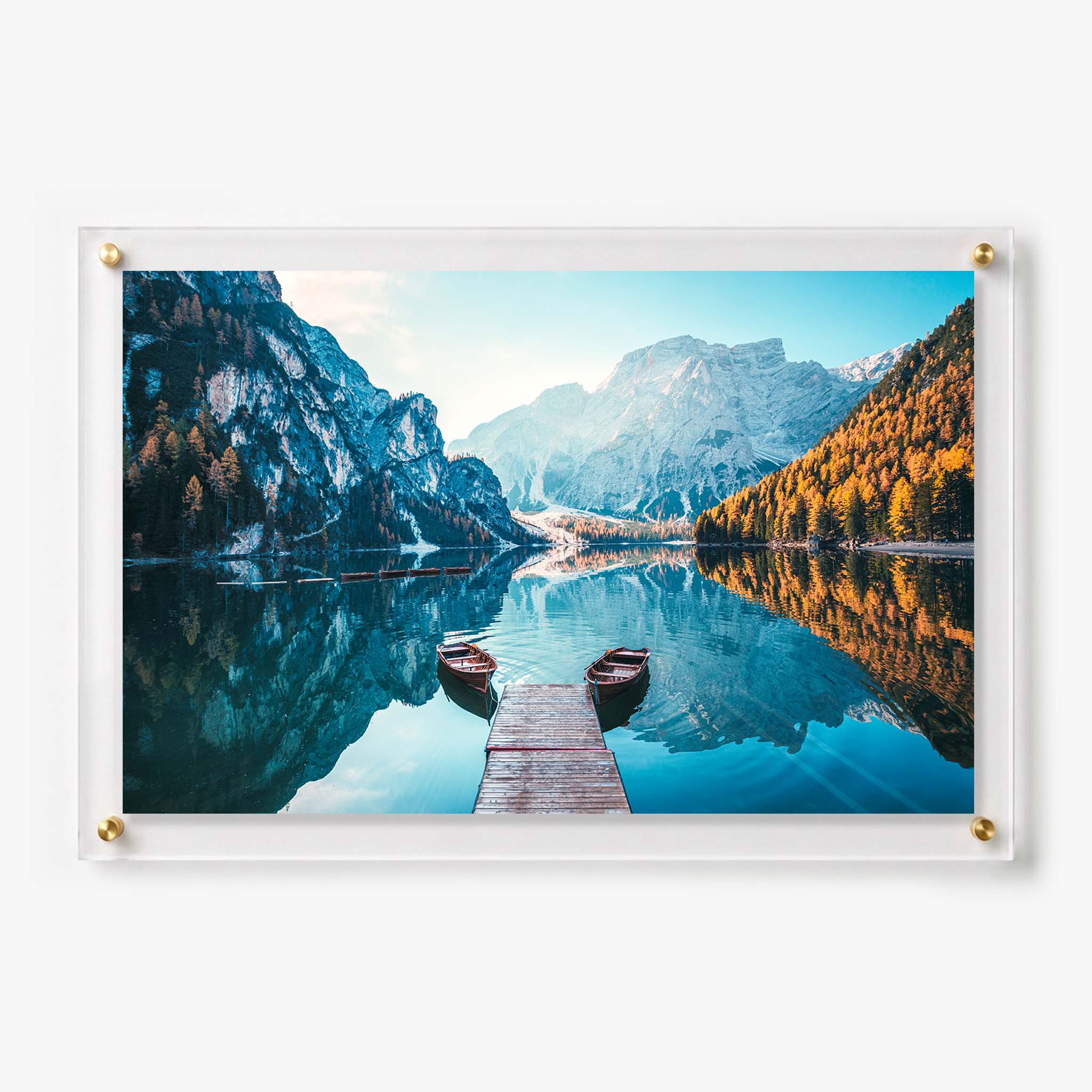 Acrylic wall art featuring two wooden boats beside a dock surrounded by mountains