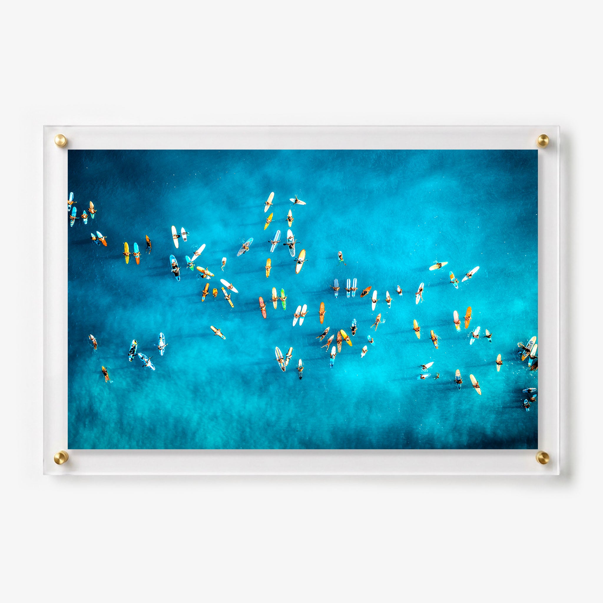 Acrylic wall art featuring dozens of surfers waiting on colorful boards 